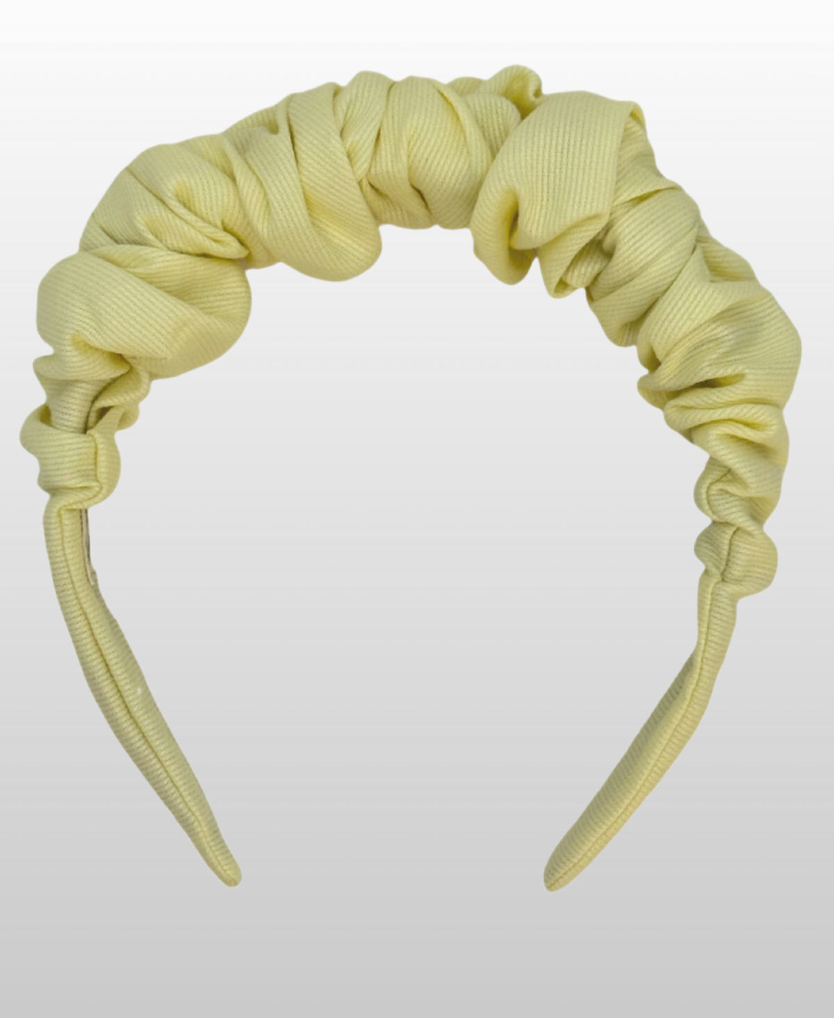 Serre-tête jaune pastel 100% coton.