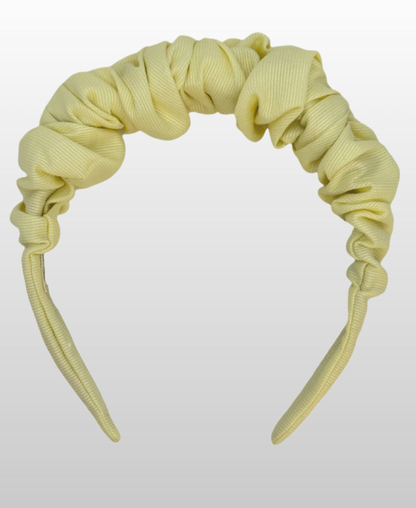 Serre-tête jaune pastel 100% coton.